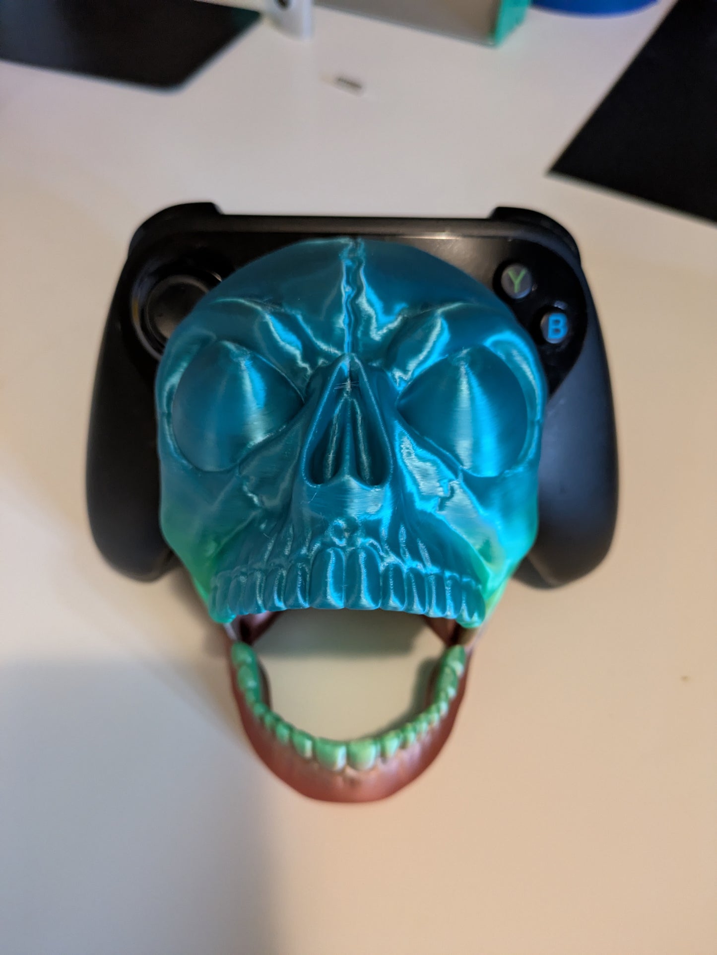 Screaming skull game controller holder